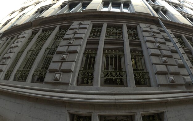 A close-up of the US Federal Reserve building, emphasizing its architectural details. The image is sharp and professional, suggesting authority and stability.