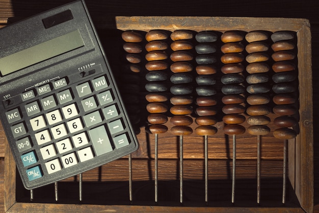 A close-up of a calculator with numbers representing the potential tax credit amount, set against a backdrop of tax forms and financial documents. This visual emphasizes the calculation and financial aspects of the enhanced child tax credit.