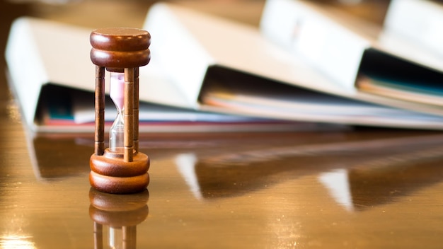 A gavel hitting a sound block in a courtroom, with documents related to student loan policies scattered around, symbolizing legal and policy changes impacting student loan forgiveness.