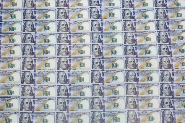 A split image contrasting a stack of US dollars gradually shrinking under the word 